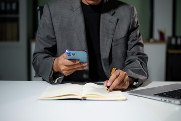 businessman using a stylus with digital tablet in office. Concept of smart technology, remote work