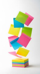 Colorful sticky notes floating above a stack.