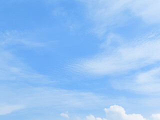 Clear blue sky with soft cloud with daylight natural background. Soft white clouds float in the...