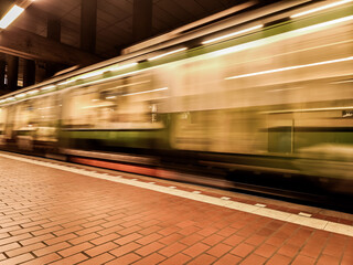 Blurred subway in motion, showing a fast-moving train on a platform. Moving subway in the city of Hanover (30159), Germany, at the Markthalle Landtag stop. © Frank