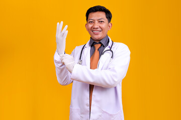 Asian Doctor Man Smiling With Braces, Wearing Medical Gloves And Looking Confident
