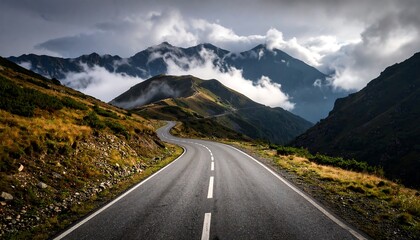 Naklejka premium Winding mountain road through a valley