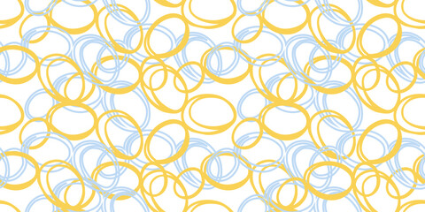 Seamless abstract pattern of overlapping hand drawn circles in blue and yellow tones on a white background. Plain ornament print for modern fabrics, home decor, wallpapers, graphic design projects.