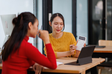 Financial team Business women analyze the graph of the company's performance to create profits and growth, Market research reports and income statistics, Financial and Accounting concept.	
