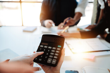 The financiers are calculating personal taxes for their customers.
