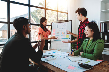 Brainstorming of young modern group. Team meeting to achieve goal. Business people discussing finance business and analysis. Teamwork concept in modern office. Calculating personal tax for client.