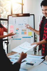Brainstorming of young modern group. Team meeting to achieve goal. Business people discussing finance business and analysis. Teamwork concept in modern office. Calculating personal tax for client.