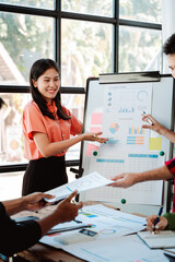 Brainstorming of young modern group. Team meeting to achieve goal. Business people discussing finance business and analysis. Teamwork concept in modern office. Calculating personal tax for client.