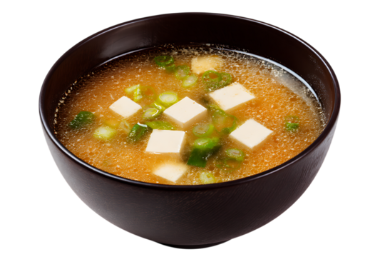 On transparent background a closeup shot of a steaming bowl of japanese miso soup filled with cubes of tofu and - Powered by Adobe