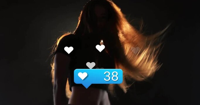 Female social media creator reacting to blue like count bubble on stage dancing with heart icons
