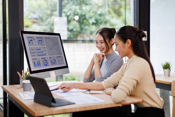 Fototapeta premium Two business women meeting with analytics in office as web developer in internship, workshop and company. Team, collaboration and digital agency for metrics, growth or career in brand design 