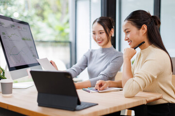 Fototapeta premium Two business women meeting with analytics in office as web developer in internship, workshop and company. Team, collaboration and digital agency for metrics, growth or career in brand design 