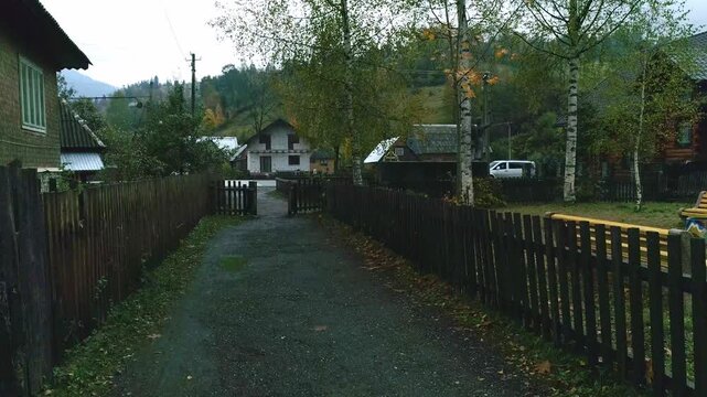 Comfy road with wood fence in village, architecture lane environment, divider wood fence, rural countryside road
