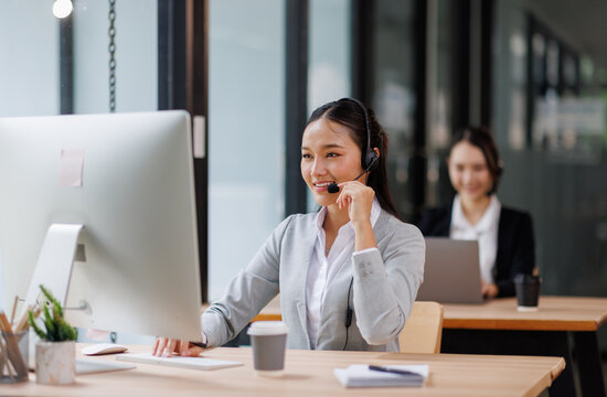 Young asian woman using a headset and computer in a modern office, Customer Service Representative, Service, Call Center, Using Phone, Office
