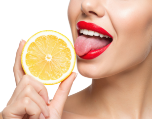 A woman with bright red lipstick sticks out her tongue near a fresh lemon half against a black background.