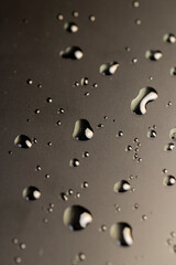 wet protective film glued to the touch screen of a modern device covered with water droplets