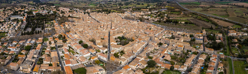 Aerial panorama view of the city Pézenas in France on a sunny autumn day	