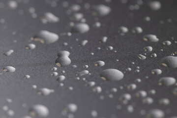 silver colored metal surface covered with drops of water, wet silver-colored metal painted to protect aluminum alloy and metals, close up