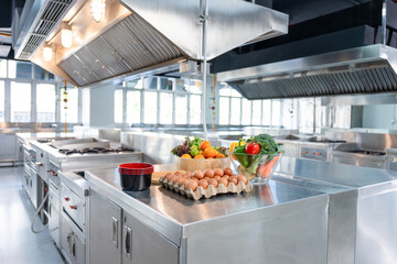 Professional Stainless Steel Commercial Kitchen with Fresh Ingredients for Background, Modern...