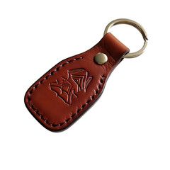 Brown leather keychain with embossed emblem isolated on transparent background