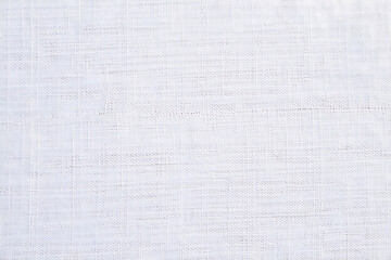 Subtle textured white fabric background with delicate horizontal lines