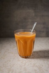 Cha thai ,Thai milk Tea, Traditional Thai tea with sweetened condensed on grey background