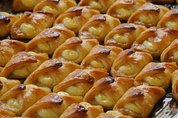 Full tray of freshly-baked, custard-filled pastry.