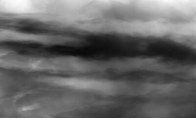 Foggy texture enhances the ominous dark stormylooking clouds in this striking black and white image.