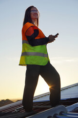 Renewable Energies. Female Solar Panel Installer Technician Solving an Incident