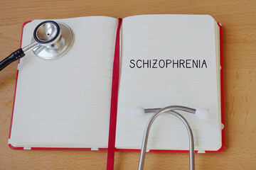 Medical Concepts. Mental Health. Word Schizophrenia Written on a Medical Notebook.