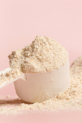 Plastic measuring scoop with protein powder