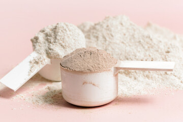 Plastic measuring scoop with protein powder