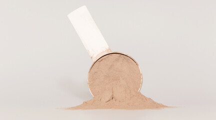 Plastic measuring scoop with protein powder