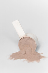 Plastic measuring scoop with protein powder