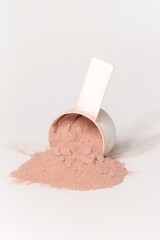 Plastic measuring scoop with protein powder