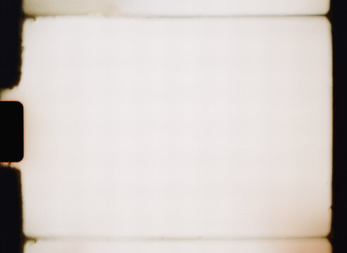 Old film frame showing light leaks and scratches as background texture
