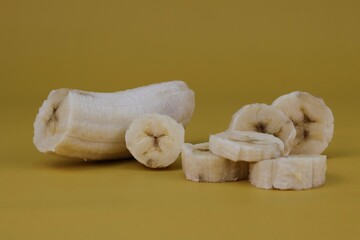 Sliced of banana isolated on yellow background