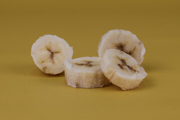 Sliced of banana isolated on yellow background