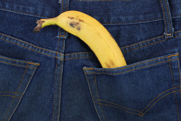 Sweet banana in the back pocket of men's blue jeans
