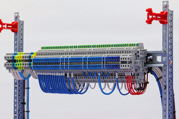 Electrical terminals with connected insulated copper wires with metal lugs. Marking with a thermal printer. 