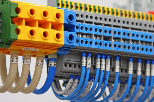Electrical terminals with connected insulated copper wires with metal lugs. Marking with a thermal printer. 