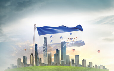 Honduras national flag wavering with modern building skyline. Country showing stronger and...