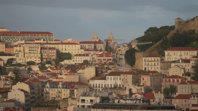 Panoramic view of Lisbon and castle from Miradouro de SALo Pedro de AlcA?ntara at sunset, Lisbon, Portugal, Europe