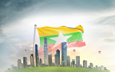 Myanmar (Burma) national flag wavering with modern building skyline. Country showing stronger and...