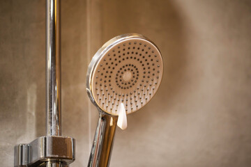 modern chrome shower head in bathroom close up, industry