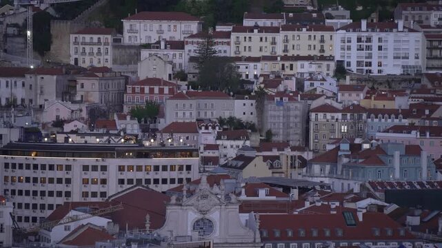 Panoramic view of Lisbon and castle from Miradouro de SALo Pedro de AlcA?ntara at dusk, Lisbon, Portugal, Europe