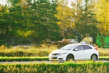 White city car traveling near construction area
