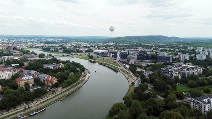 Urban landscape featuring river and green spaces