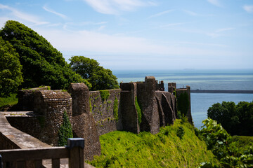 English landscape near Dover Castle with a view of the bay and the sea. Concept of historic heritage, old castles, and scenic travel destinations across England and the UK