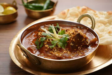 Authentic Indian Lamb Curry Food: Rich, Aromatic Stew with Naan Bread in Brass Bowl